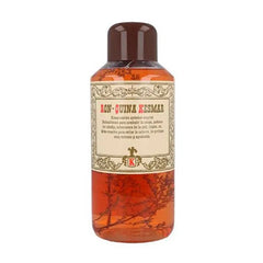 Bottle of Ron Quina Kesmar with a label on a white background