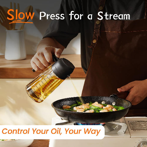 Person cooking with a bottle of oil labeled 'Slow Press for a Stream' in a kitchen setting.